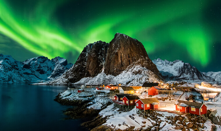small village with northern lights above